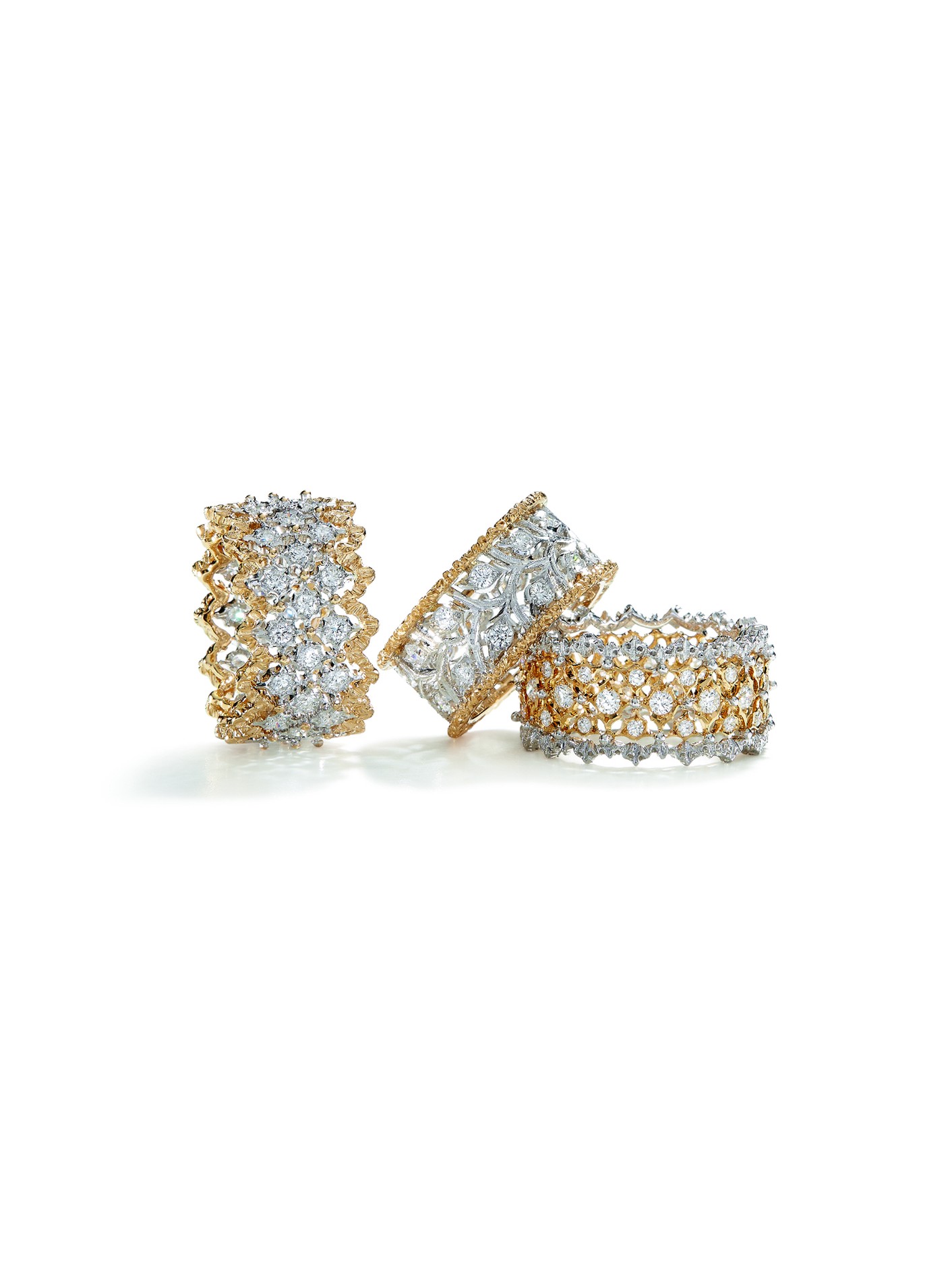 Rombi Eternelle rings in white and yellow gold set with diamonds, with scalloped gold borders
